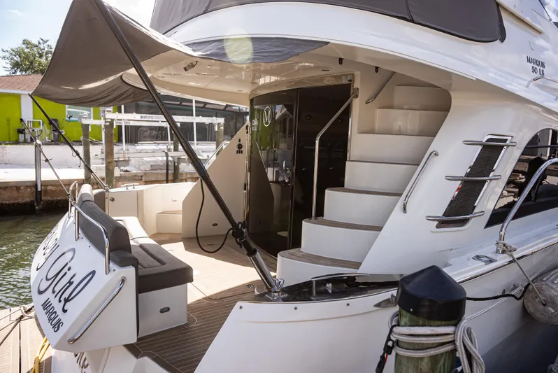  Yacht Photos Pics Luxury 2008 Marquis 50 LS yacht docked, featuring elegant design and spacious deck area.