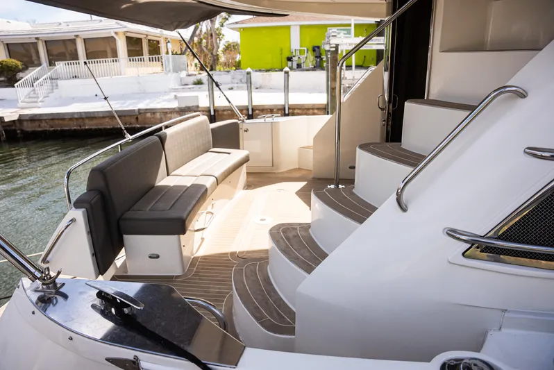  Yacht Photos Pics 2008 Marquis 50 LS yacht interior with elegant seating and curved stairs.