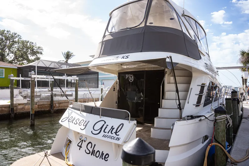  Yacht Photos Pics 2008 Marquis 50 LS yacht docked, named "Jersey Girl," with elegant design and spacious deck.