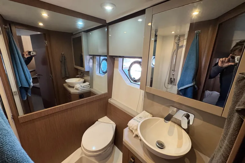  Yacht Photos Pics Luxurious bathroom in 2020 Monte Carlo 52 yacht with modern fixtures and elegant design.