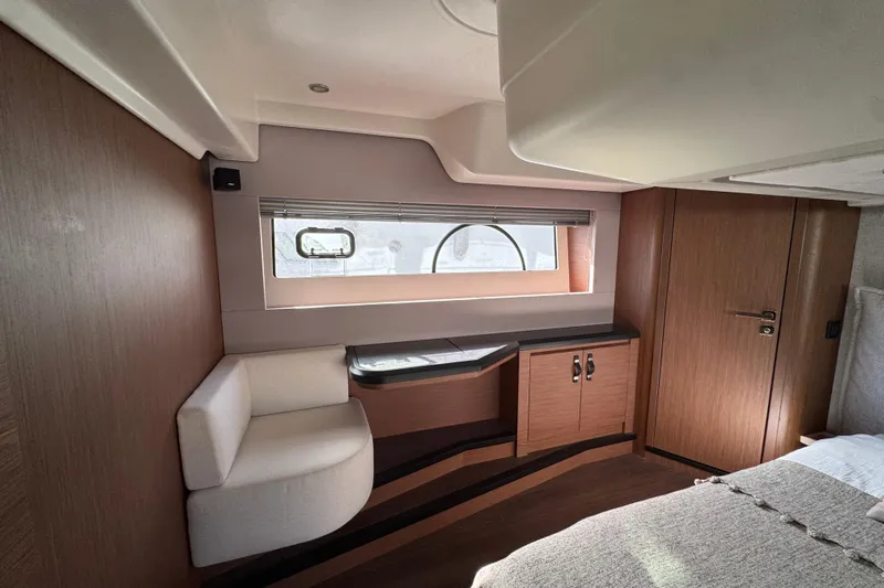  Yacht Photos Pics Luxurious interior of 2020 Monte Carlo 52 yacht with modern wood finishes and seating.