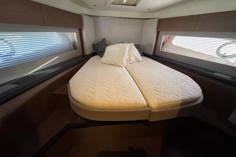  Yacht Photos Pics Luxurious bedroom interior of 2020 Monte Carlo 52 yacht with cozy bed and modern design.