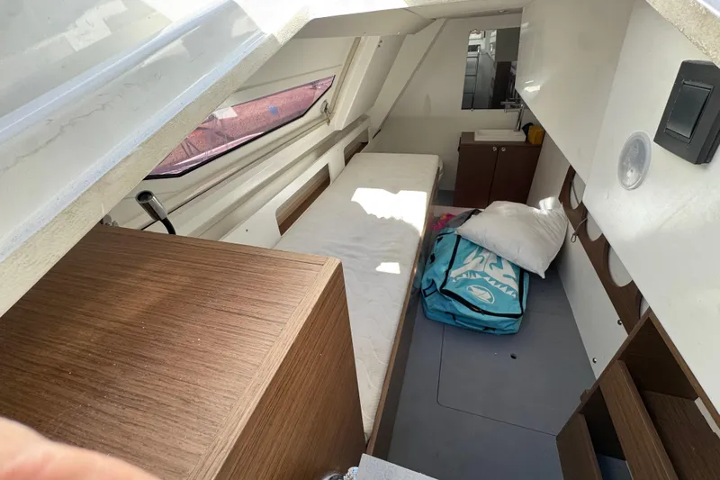  Yacht Photos Pics Interior cabin of 2020 Monte Carlo 52 yacht with bed and storage.