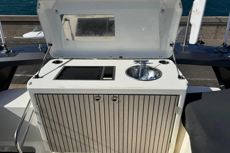  Yacht Photos Pics Outdoor kitchenette on 2020 Monte Carlo 52 yacht with sink and grill.