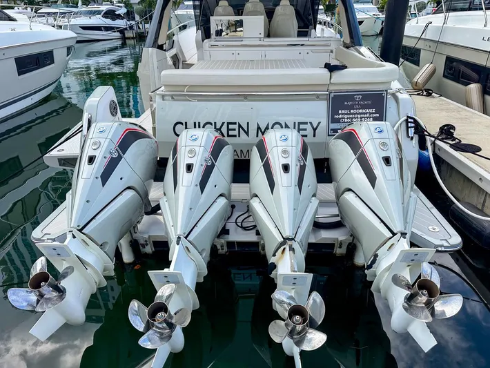  Yacht Photos Pics 2023 Azimut Verve 47 with four powerful outboard engines docked at a marina.