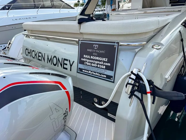  Yacht Photos Pics Azimut Verve 47 yacht, 2023 model, named "Chicken Money" with contact details displayed.