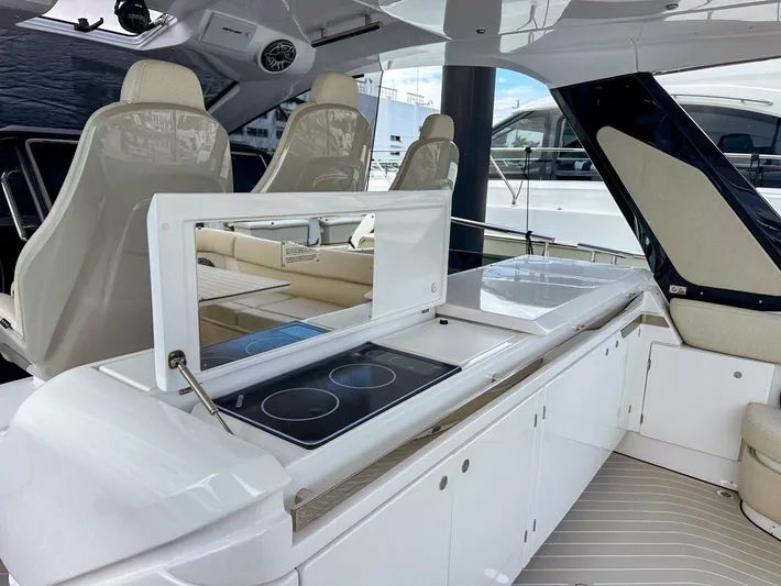  Yacht Photos Pics 2023 Azimut Verve 47 yacht interior with modern kitchen and seating area.