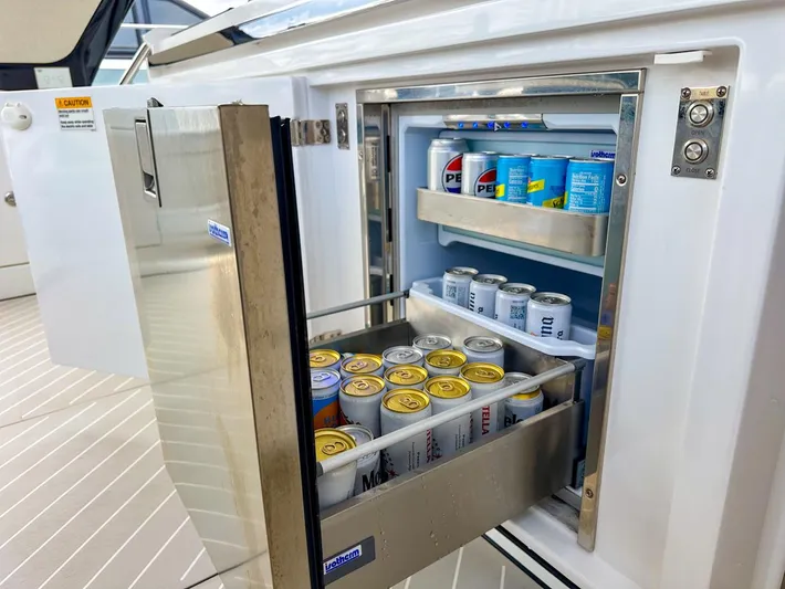 Yacht Photos Pics Open fridge on 2023 Azimut Verve 47 yacht, stocked with beverages.