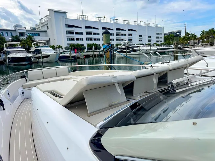  Yacht Photos Pics 2023 Azimut Verve 47 yacht docked at marina with luxurious seating.