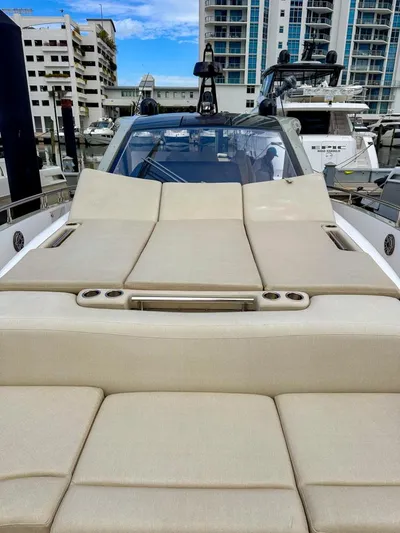  Yacht Photos Pics 2023 Azimut Verve 47 luxury yacht with beige sunbathing deck, docked in marina.