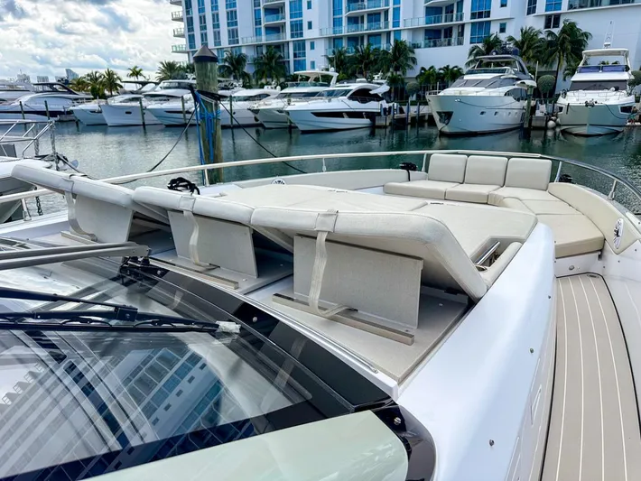  Yacht Photos Pics 2023 Azimut Verve 47 yacht with luxurious deck seating in a marina setting.