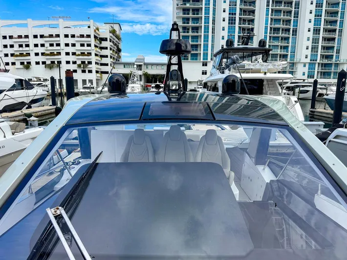  Yacht Photos Pics 2023 Azimut Verve 47 yacht docked at marina with modern design and cityscape background.