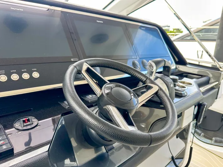  Yacht Photos Pics 2023 Azimut Verve 47 yacht helm with modern steering and navigation displays.