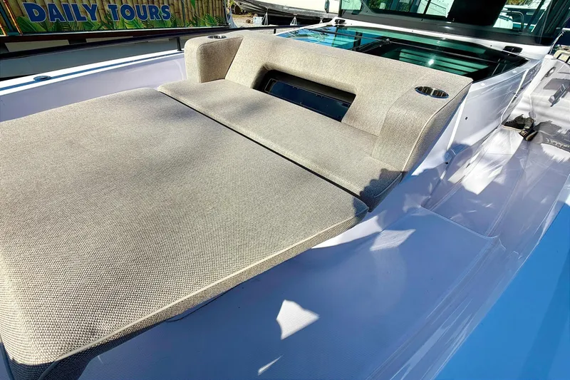  Yacht Photos Pics 2025 Axopar 37 XC CROSS CABIN with cushioned seating area on deck.