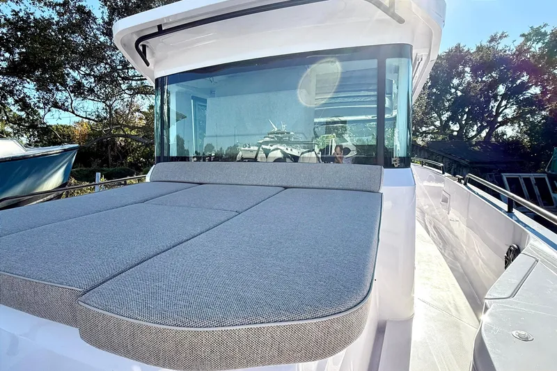  Yacht Photos Pics 2025 Axopar 37 XC CROSS CABIN with spacious sunbed and sleek design.