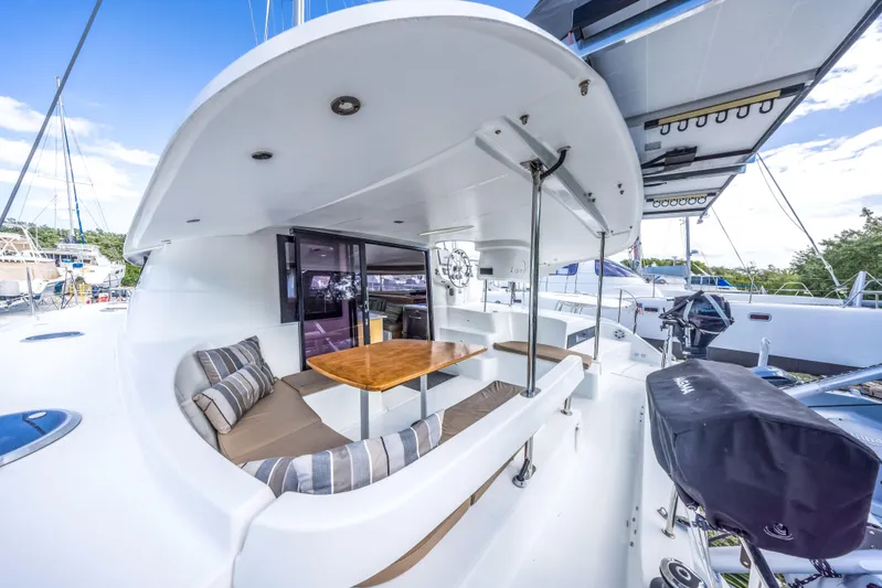 Breathing Room Yacht Photos Pics 2014 Fountaine Pajot Lipari 41 catamaran with outdoor seating and dining area.