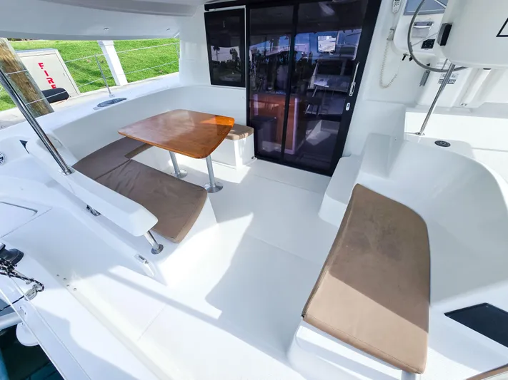 Breathing Room Yacht Photos Pics Spacious cockpit of 2014 Fountaine Pajot Lipari 41 catamaran with seating and table.