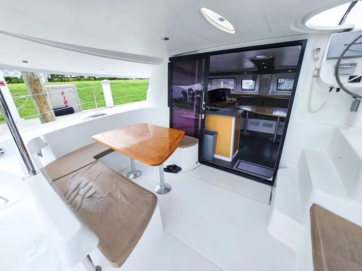 Breathing Room Yacht Photos Pics 2014 Fountaine Pajot Lipari 41 catamaran interior with seating and dining area.