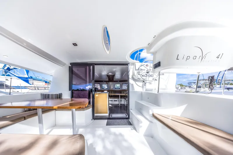 Breathing Room Yacht Photos Pics 2014 Fountaine Pajot Lipari 41 catamaran interior with seating and navigation area.