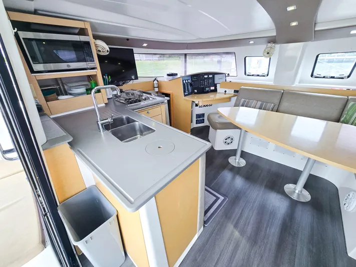 Breathing Room Yacht Photos Pics Interior of 2014 Fountaine Pajot Lipari 41 catamaran with modern kitchen and seating area.
