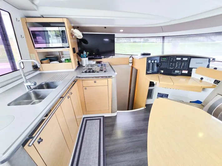 Breathing Room Yacht Photos Pics Modern kitchen and navigation area inside a 2014 Fountaine Pajot Lipari 41 catamaran.