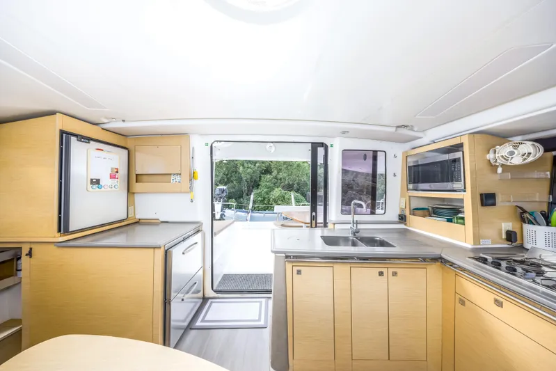 Breathing Room Yacht Photos Pics Interior of 2014 Fountaine Pajot Lipari 41 catamaran kitchen with modern amenities.