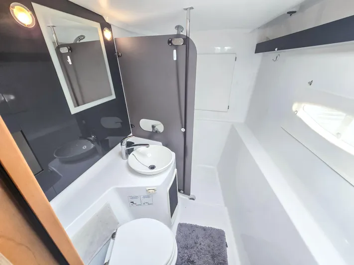 Breathing Room Yacht Photos Pics Bathroom interior of 2014 Fountaine Pajot Lipari 41 catamaran, featuring modern fixtures and lighting.