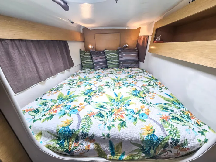 Breathing Room Yacht Photos Pics Cozy cabin interior of 2014 Fountaine Pajot Lipari 41 with floral bedding and striped pillows.