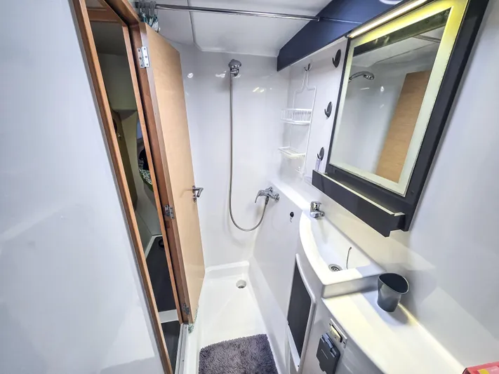 Breathing Room Yacht Photos Pics Bathroom interior of 2014 Fountaine Pajot Lipari 41 catamaran, featuring shower and sink.