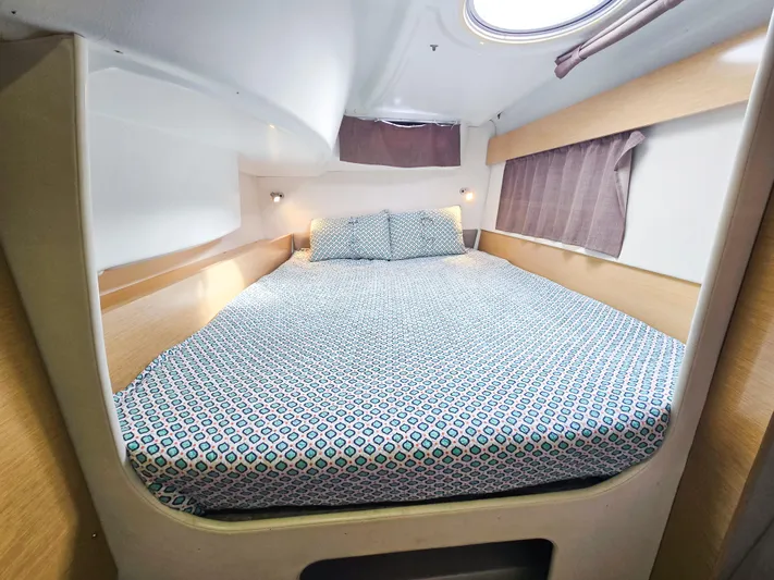 Breathing Room Yacht Photos Pics Cozy cabin interior of 2014 Fountaine Pajot Lipari 41 catamaran with patterned bedding.