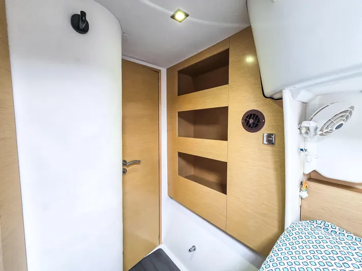 Breathing Room Yacht Photos Pics Interior of 2014 Fountaine Pajot Lipari 41 catamaran with wooden shelves and modern design.