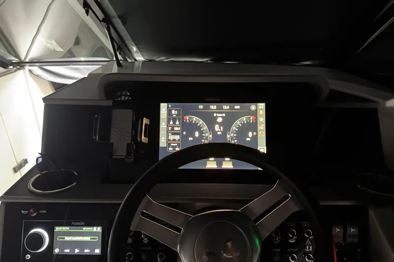  Yacht Photos Pics 2025 Sea Ray SDX 290 Outboard dashboard with digital display and steering wheel.