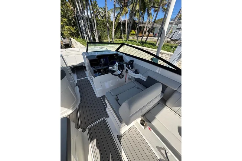  Yacht Photos Pics 2025 Sea Ray SDX 290 Outboard boat interior with modern helm and seating.