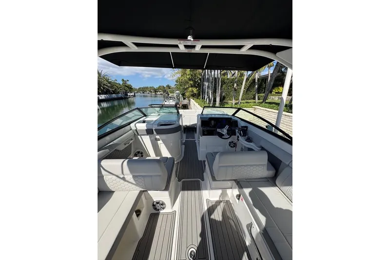  Yacht Photos Pics 2025 Sea Ray SDX 290 Outboard boat interior with luxurious seating and modern dashboard.