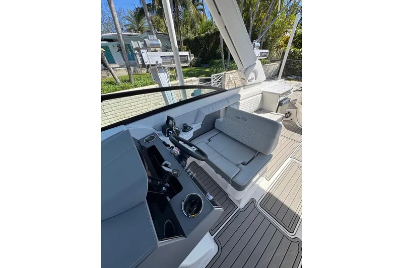  Yacht Photos Pics 2025 Sea Ray SDX 290 Outboard boat interior with sleek seating and modern controls.