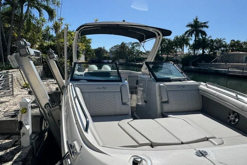  Yacht Photos Pics 2025 Sea Ray SDX 290 Outboard boat docked, featuring spacious seating and sleek design.