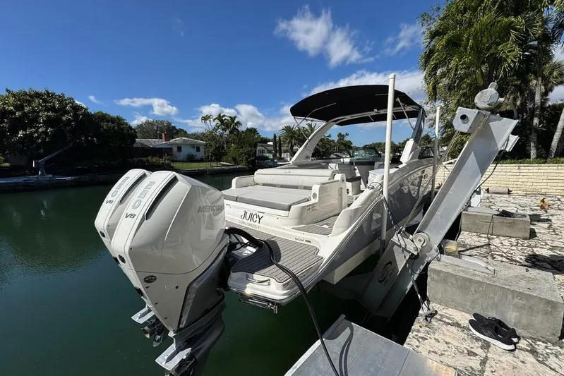  Yacht Photos Pics 2025 Sea Ray SDX 290 Outboard boat docked, featuring dual Mercury V8 engines.