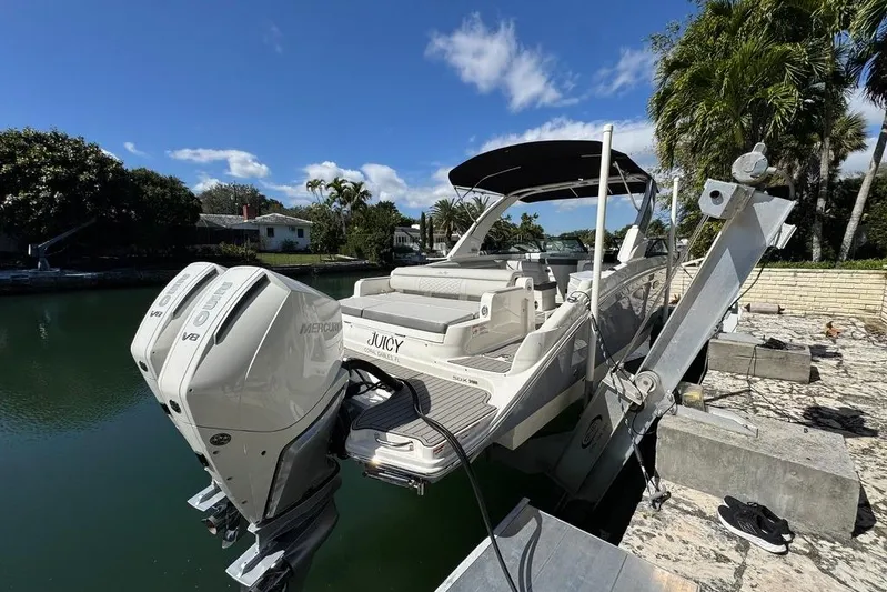  Yacht Photos Pics 2025 Sea Ray SDX 290 Outboard boat docked, featuring dual Mercury V8 engines.