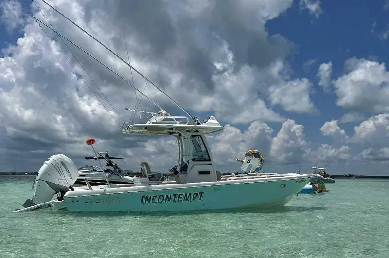 Black Label Marine Yacht Photos Pics 2021 Everglades 253 Second Station boat on clear water under cloudy sky.
