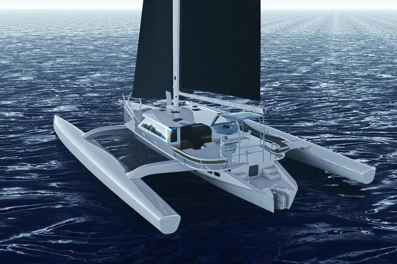  Yacht Photos Pics 2026 Rapido 63 trimaran sailing on open ocean waters.