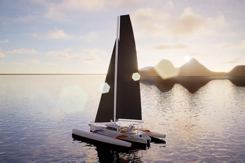  Yacht Photos Pics 2026 Rapido 63 trimaran sailing at sunset on calm waters.