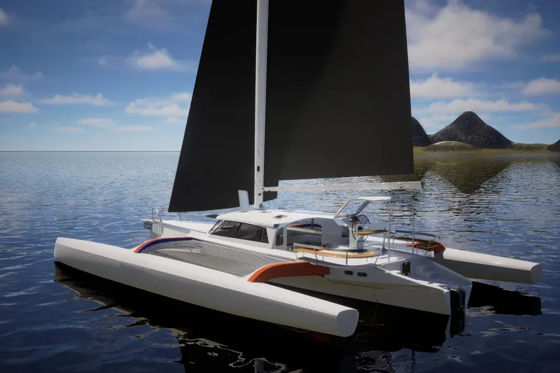  Yacht Photos Pics 2026 Rapido 63 trimaran sailing on calm waters with mountainous backdrop.