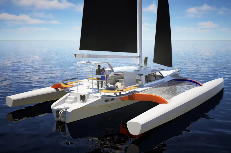  Yacht Photos Pics 2026 Rapido 63 trimaran sailing on calm ocean waters.