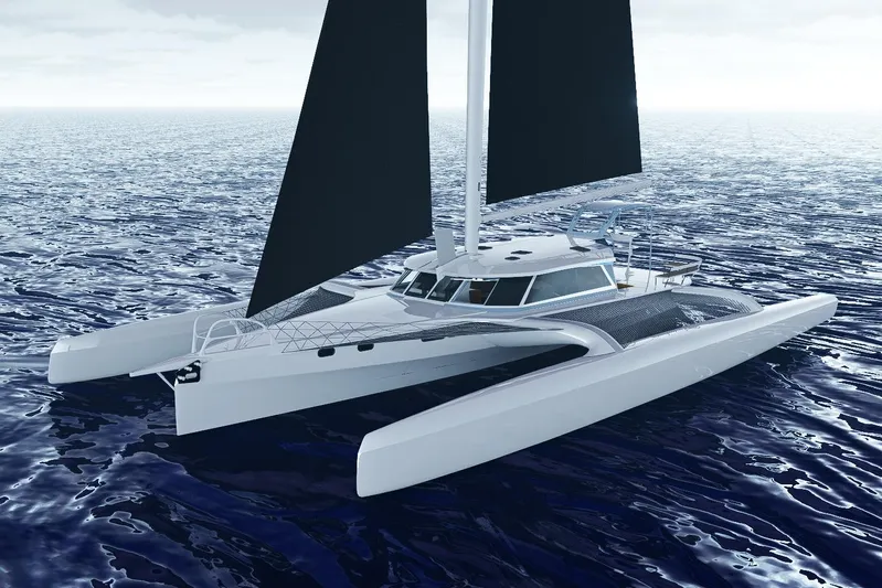  Yacht Photos Pics 2026 Rapido 63 trimaran sailing on open ocean waters.