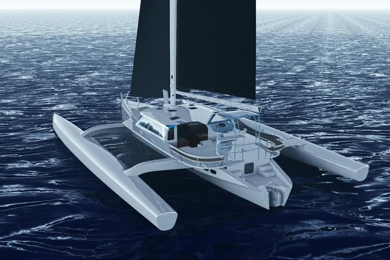  Yacht Photos Pics 2026 Rapido 63 trimaran sailing on open ocean waters.