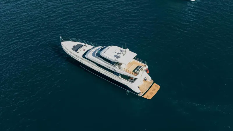 Infinite Yacht Photos Pics Aerial view of 1999 Warren Yachts 85 Motor Yacht on open water.