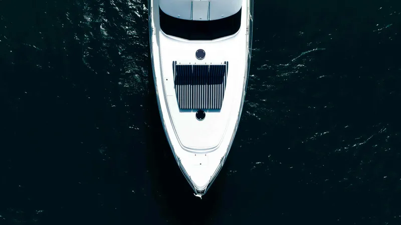 Infinite Yacht Photos Pics Aerial view of 1999 Warren Yachts 85 Motor Yacht on dark water.
