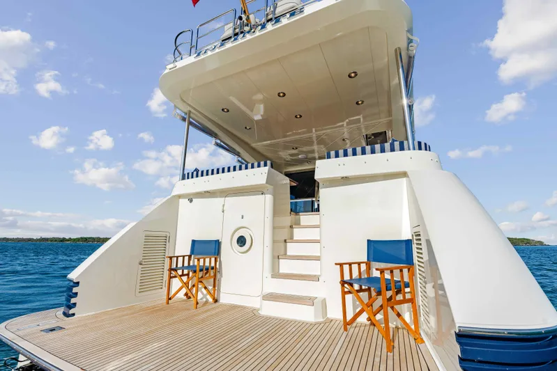 Infinite Yacht Photos Pics Warren Yachts 85 Motor Yacht 1999, rear deck view with chairs, on open water.