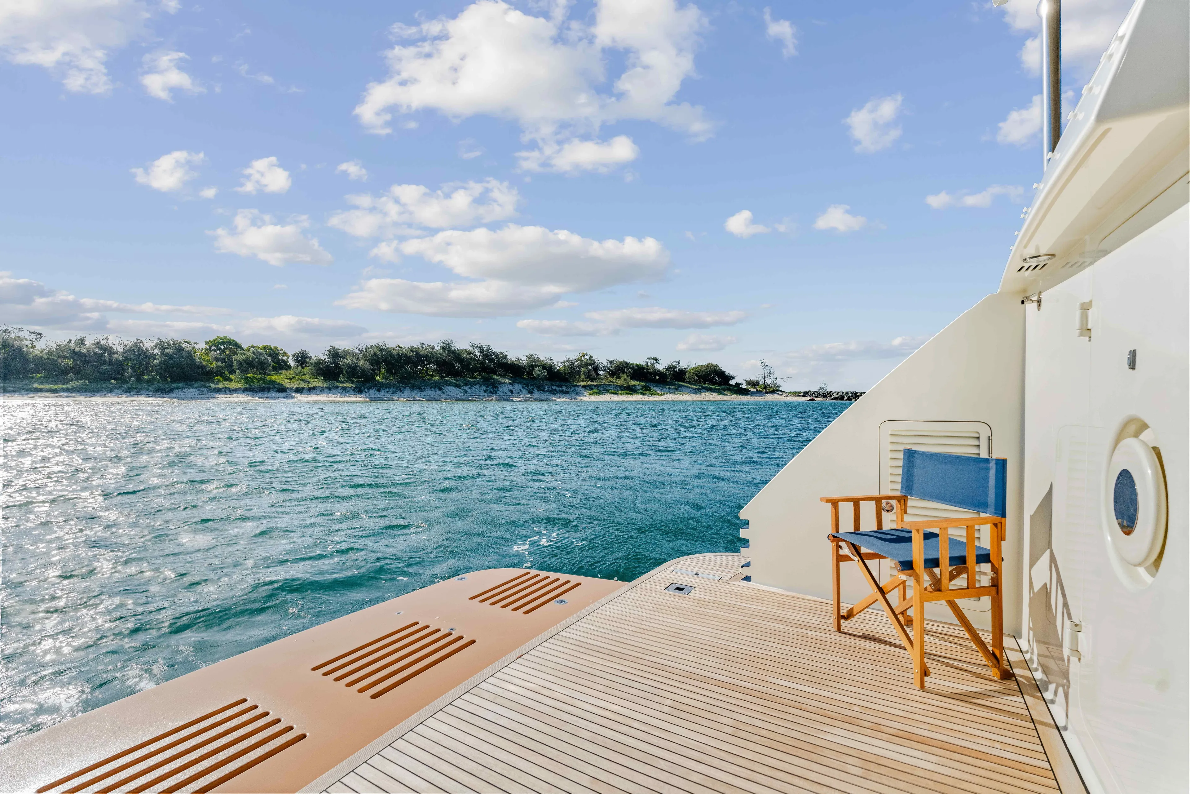 Infinite Yacht Photos Pics Warren Yachts 85 Motor Yacht 1999, deck view with ocean and island backdrop.