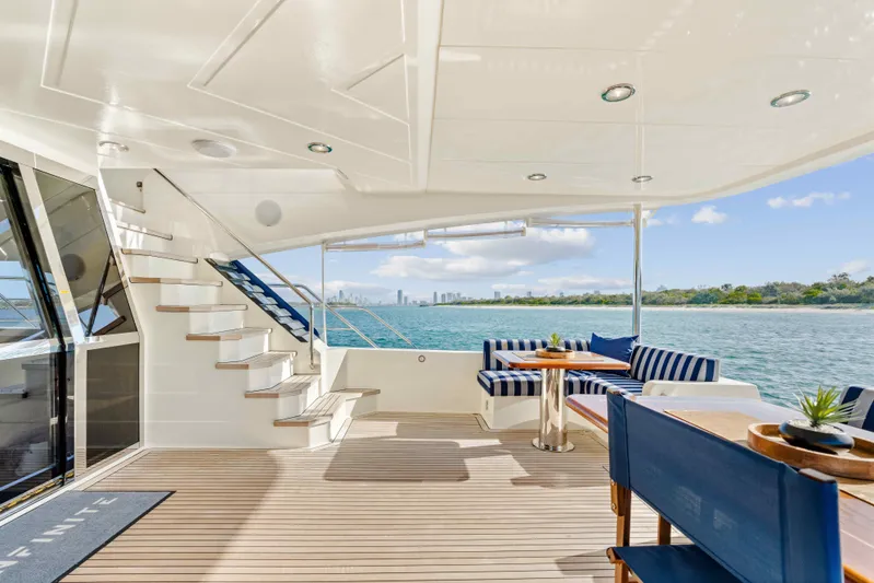 Infinite Yacht Photos Pics Luxurious 1999 Warren Yachts 85 Motor Yacht deck with scenic ocean view.